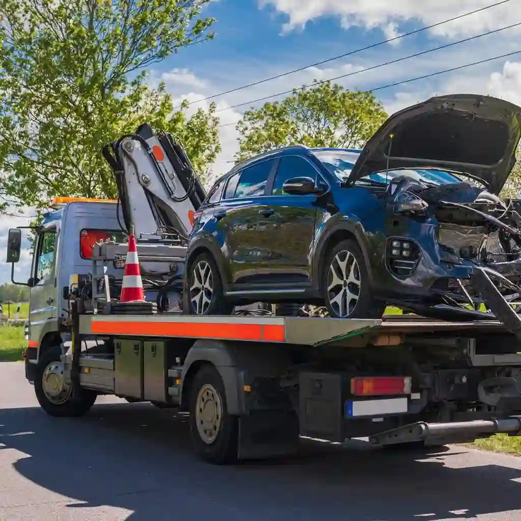 Licensed flatbed tow truck in Calgary transporting a vehicle safely