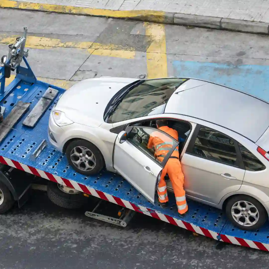 Roadside assistance technician helping a stranded car in Calgary