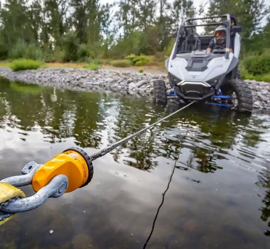 Winch recovery service pulling stuck off-road UTV from water Tow Truck Calgary.